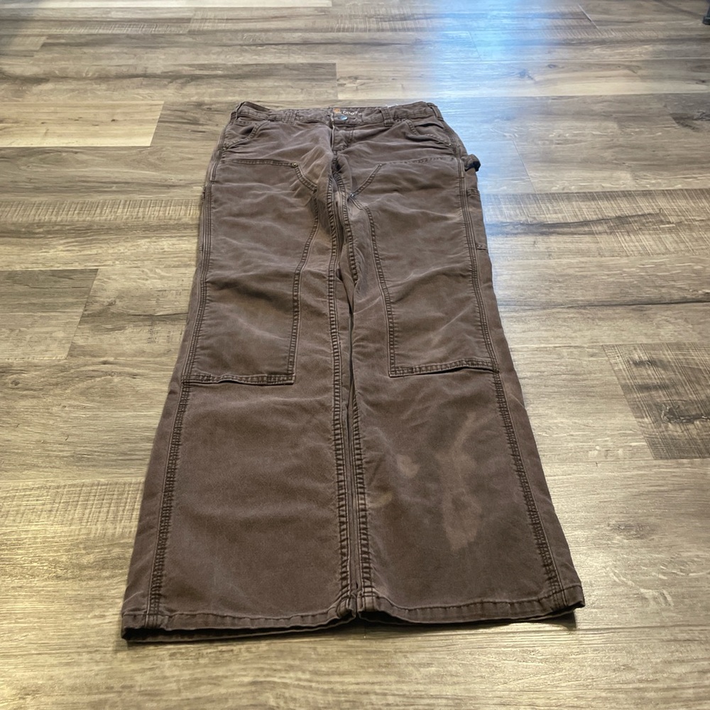 Brown faded riveted Carhartt women’s double knees